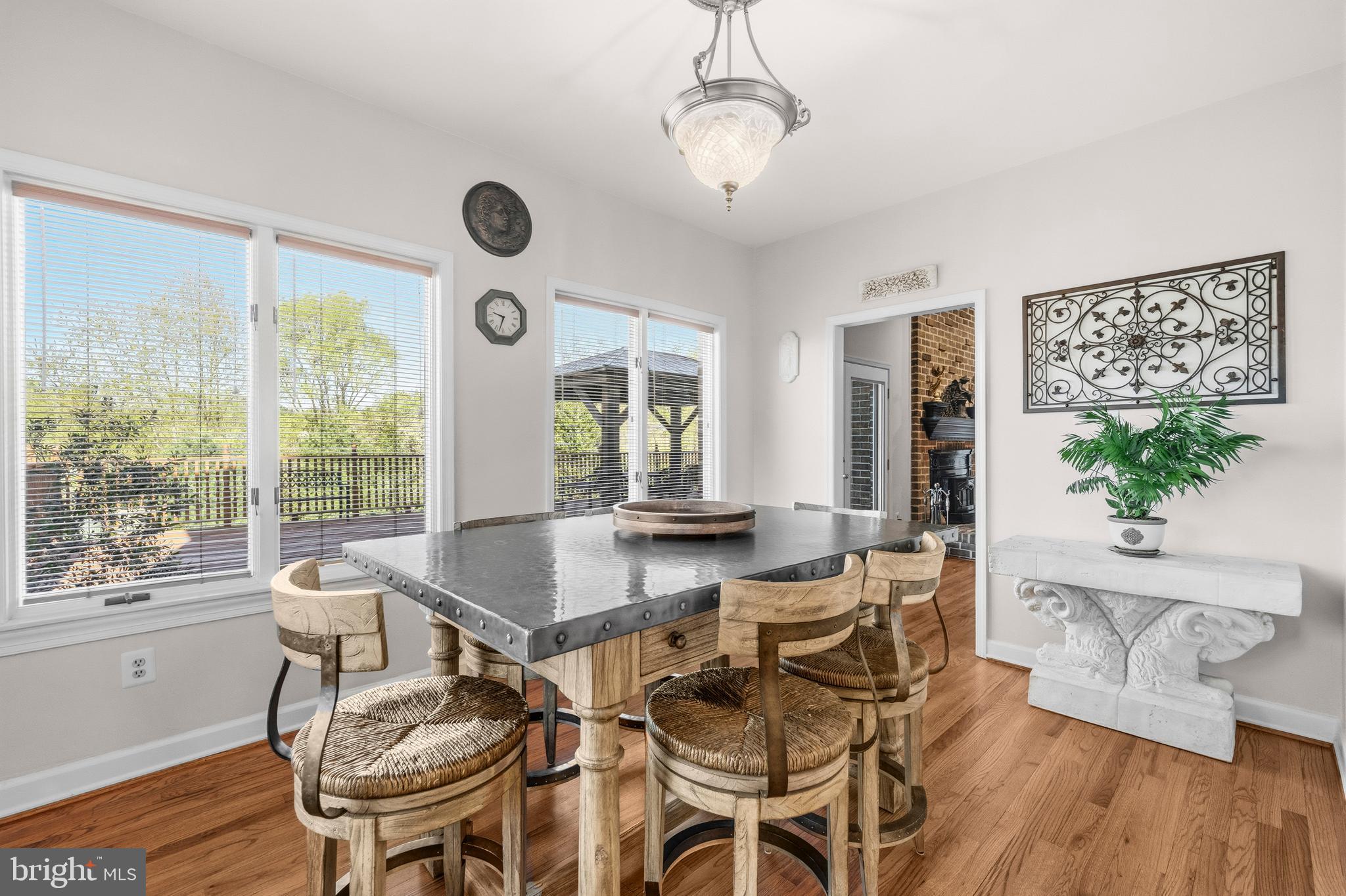 16170 Ed Warfield Road Woodbine, MD 21797 - Photo 23 of 80 a view of a dining room with furniture window and wooden floor