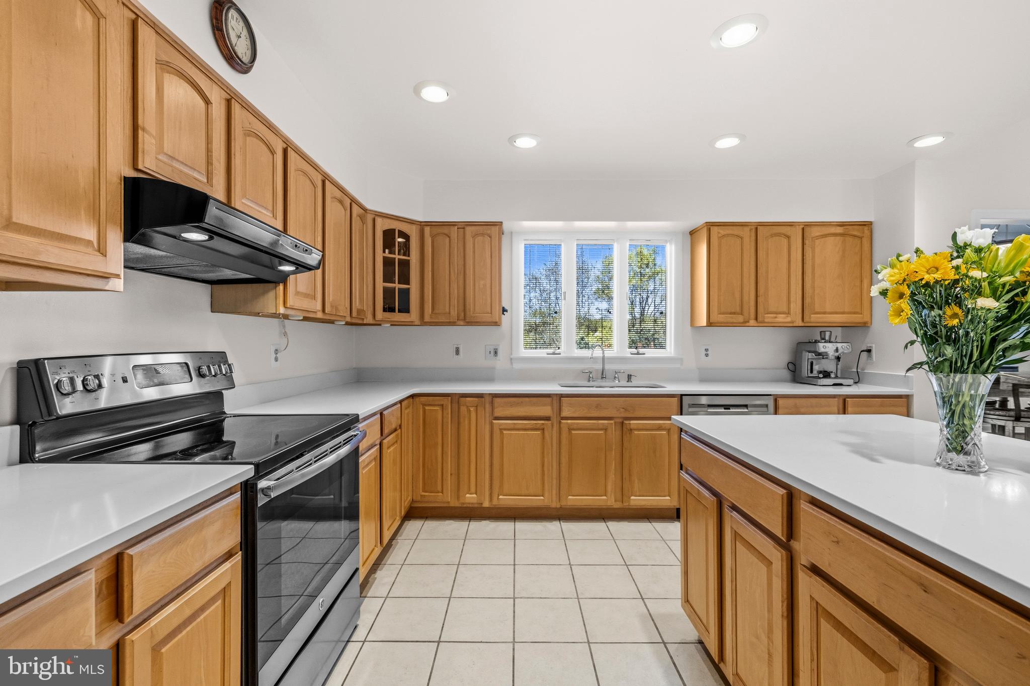 16170 Ed Warfield Road Woodbine, MD 21797 - Photo 28 of 80 a kitchen with stainless steel appliances granite countertop a sink stove and cabinets