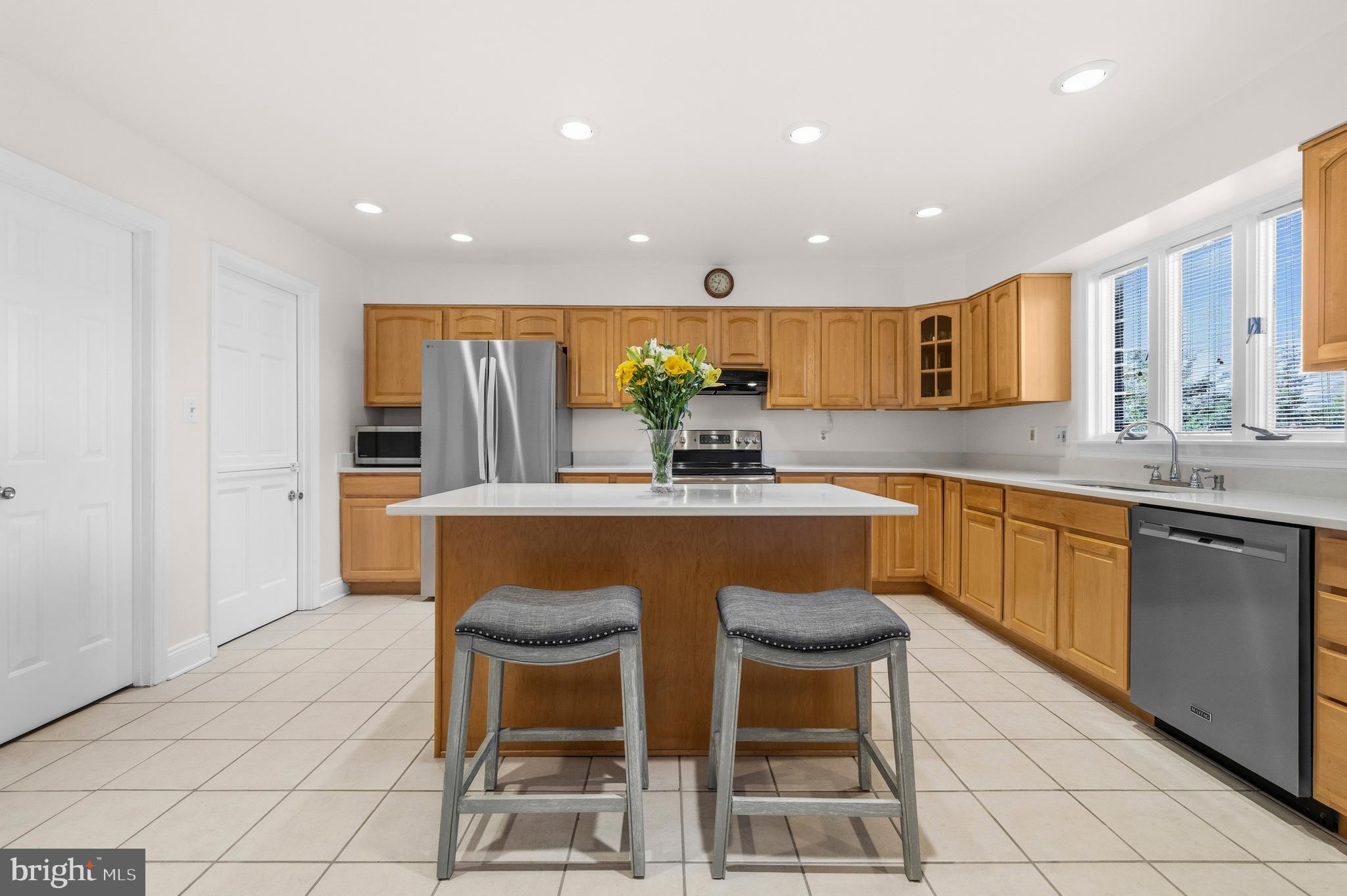 16170 Ed Warfield Road Woodbine, MD 21797 - Photo 29 of 80 a kitchen with stainless steel appliances granite countertop a sink and a refrigerator