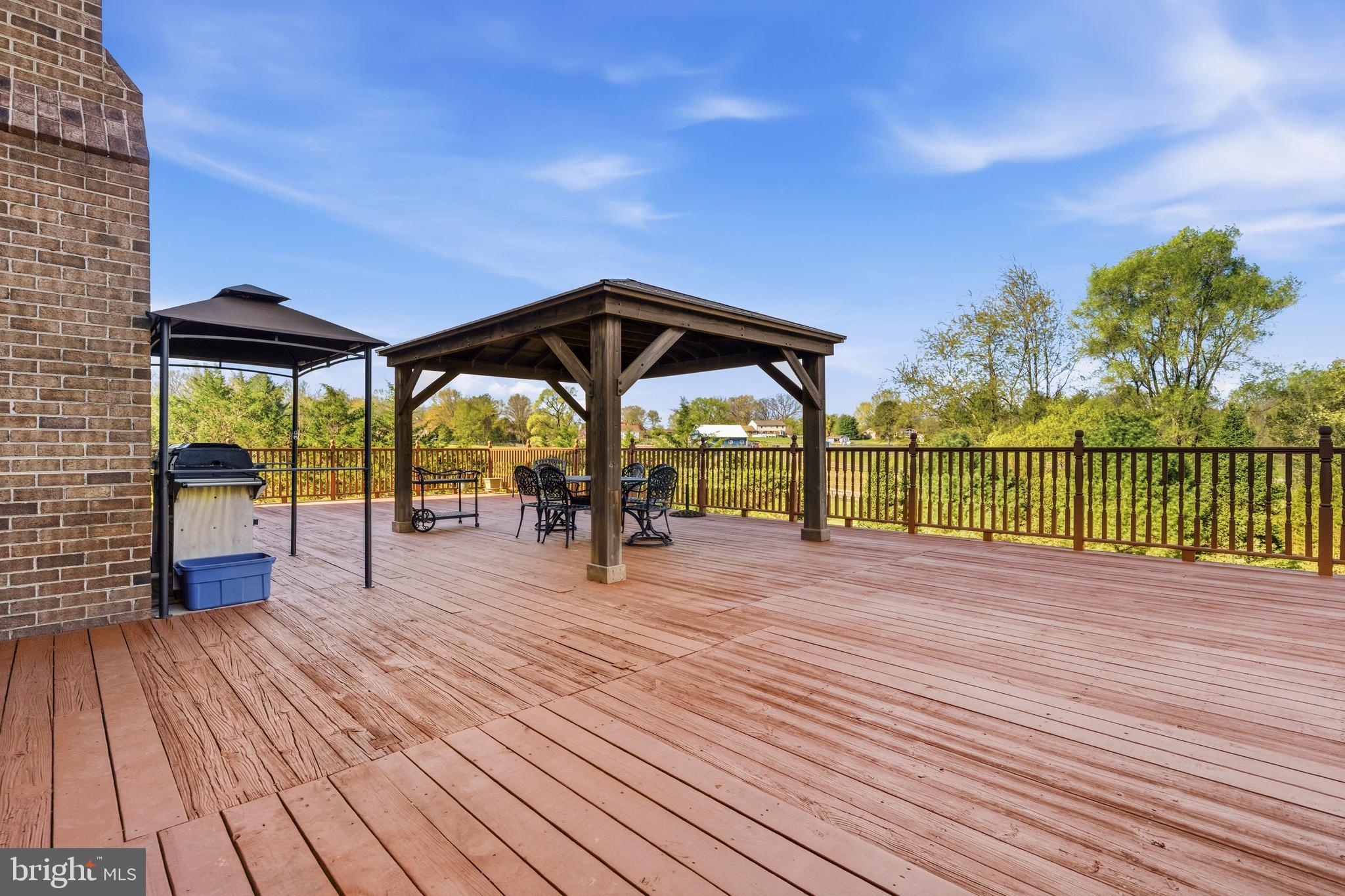16170 Ed Warfield Road Woodbine, MD 21797 - Photo 32 of 80 a view of outdoor space with deck and barbeque oven