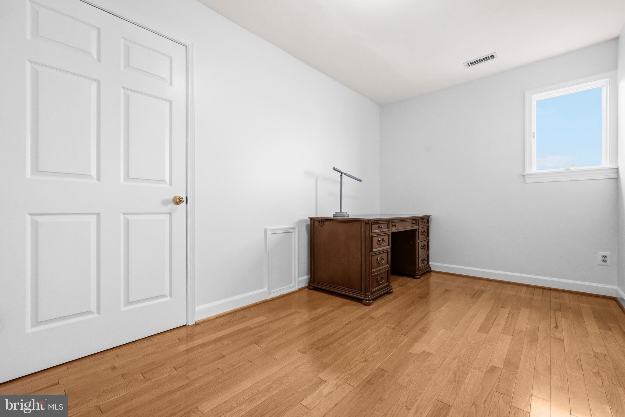 16170 Ed Warfield Road Woodbine, MD 21797 - Photo 44 of 80 a view of empty room with wooden floor