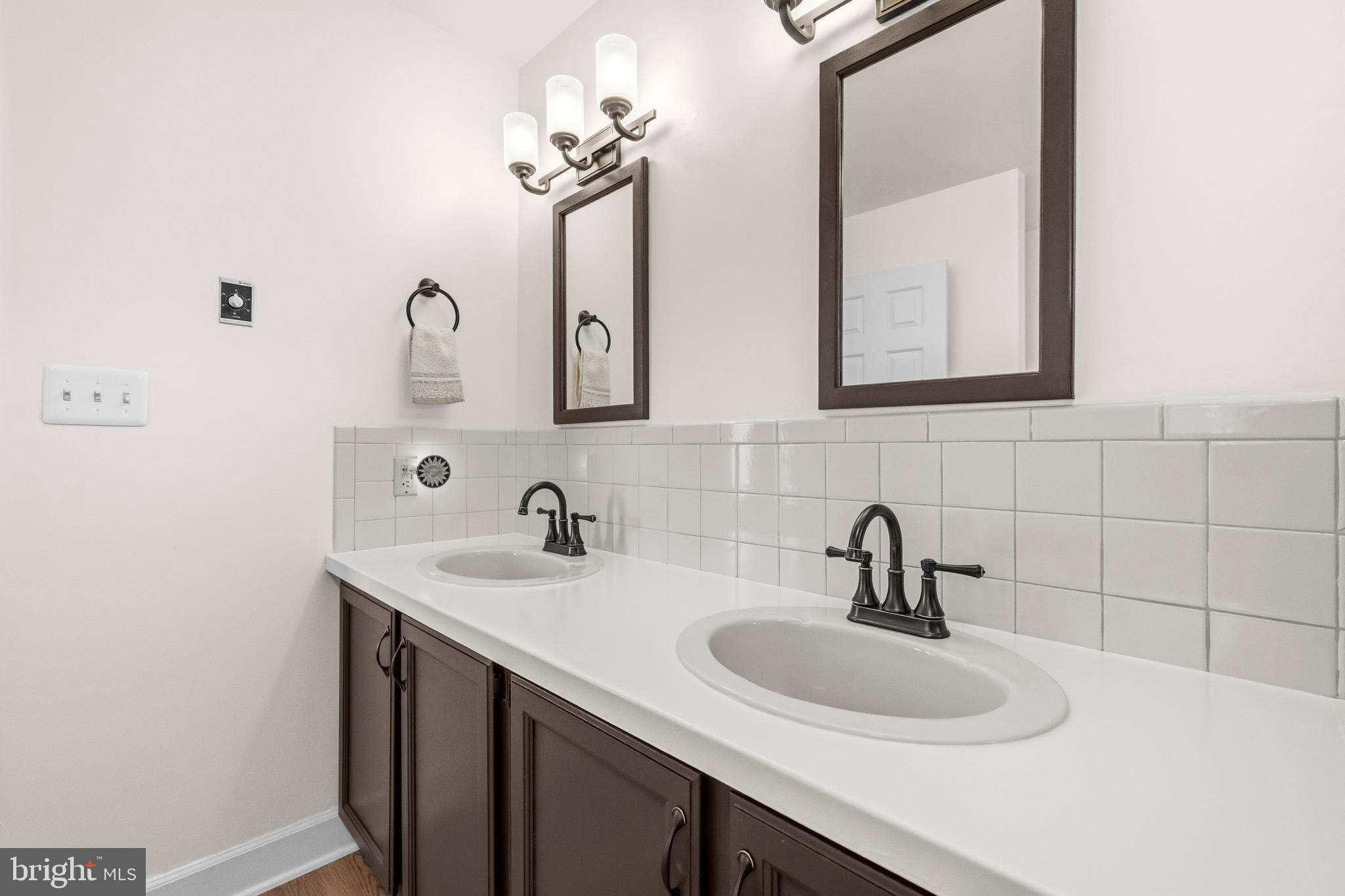 16170 Ed Warfield Road Woodbine, MD 21797 - Photo 46 of 80 a bathroom with a sink and a mirror