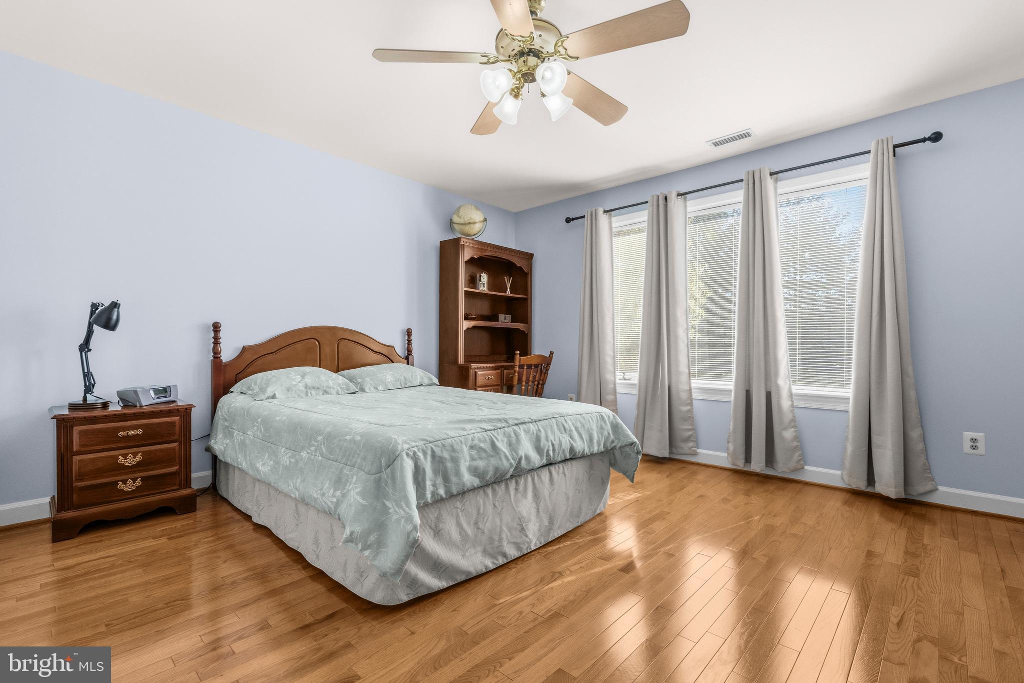 16170 Ed Warfield Road Woodbine, MD 21797 - Photo 47 of 80 a bedroom with a bed and a chandelier