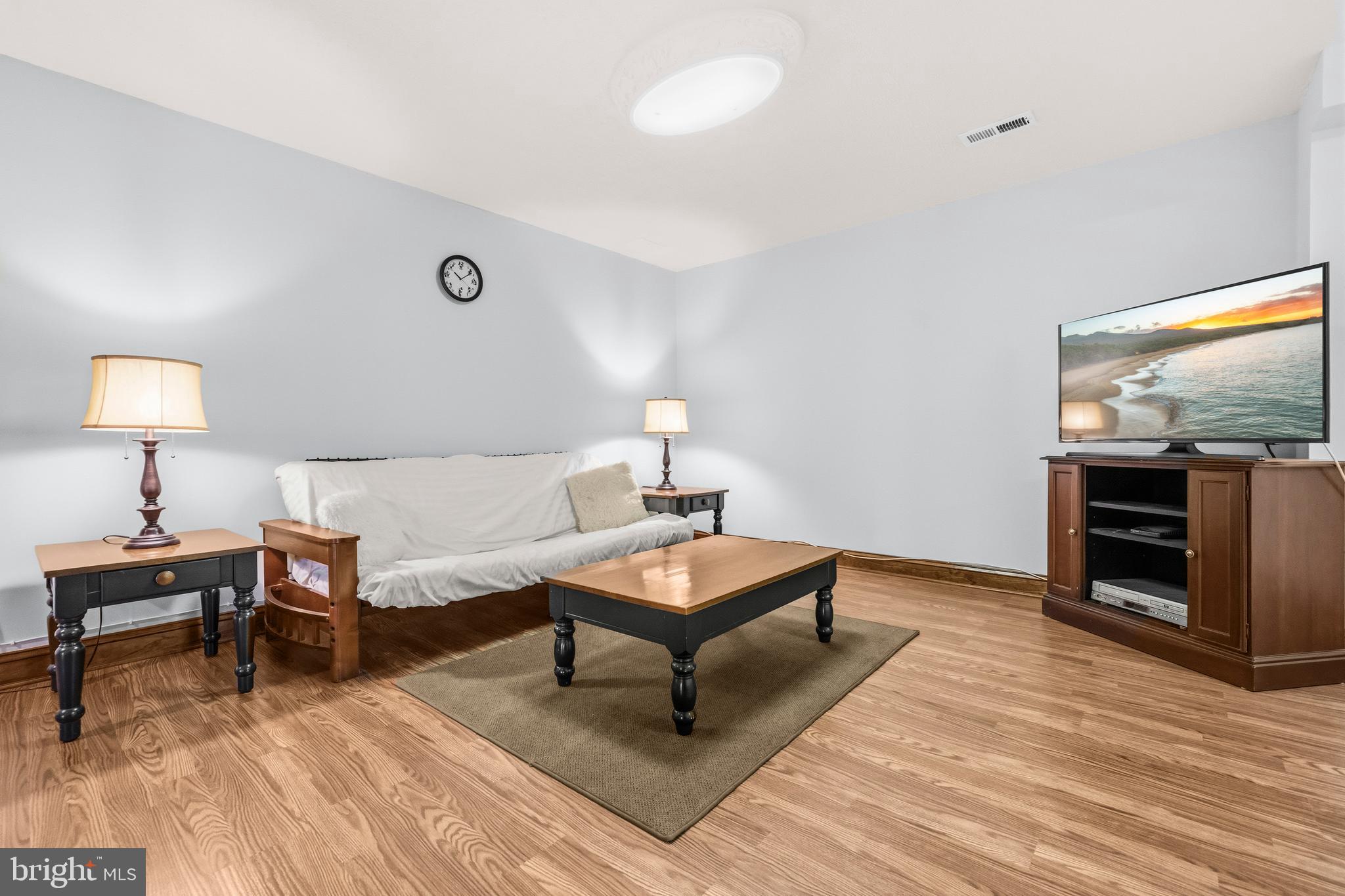 16170 Ed Warfield Road Woodbine, MD 21797 - Photo 52 of 80 a living room with furniture a piano and a flat screen tv