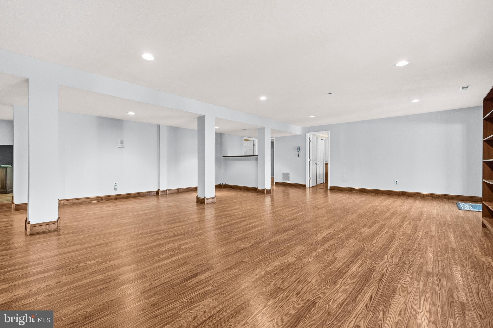 16170 Ed Warfield Road Woodbine, MD 21797 - Photo 54 of 80 a view of empty room with wooden floor and windows