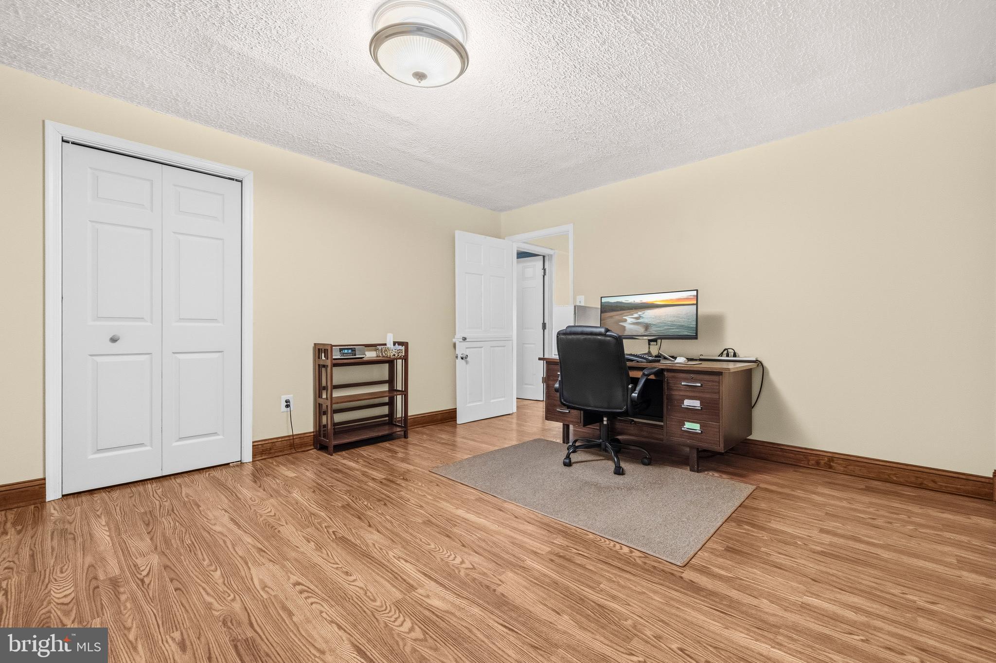 16170 Ed Warfield Road Woodbine, MD 21797 - Photo 59 of 80 a living room with furniture and a wooden floor