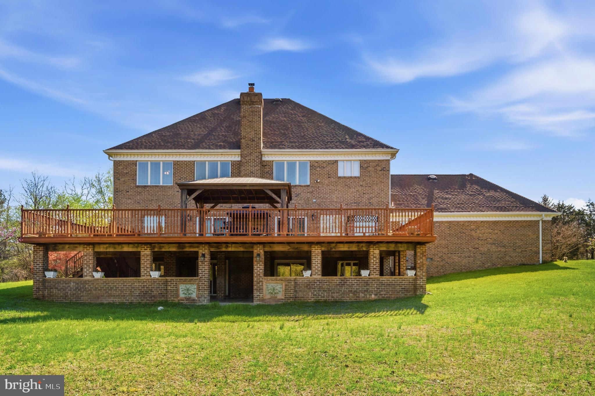 16170 Ed Warfield Road Woodbine, MD 21797 - Photo 67 of 80 a view of a house with a big yard potted plants and a large tree