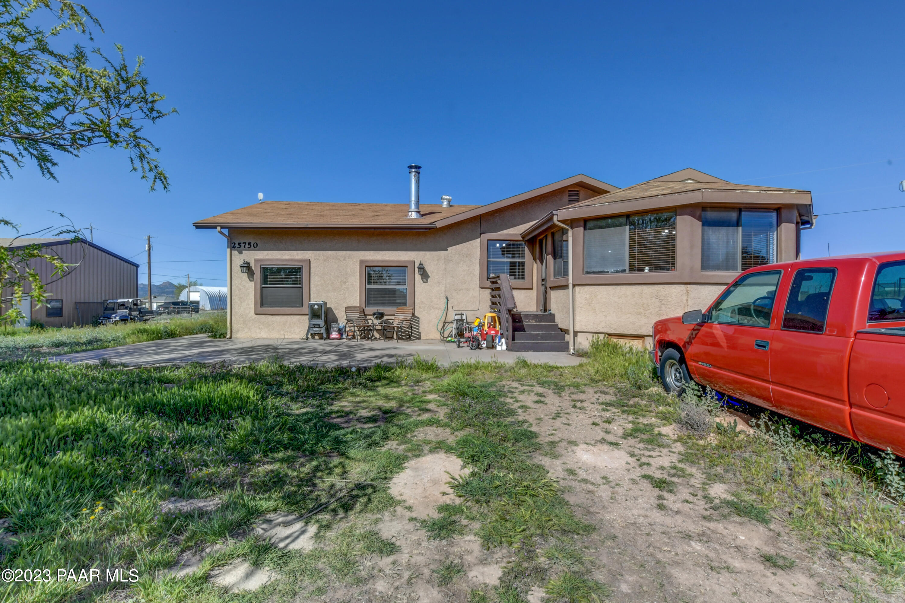 25750 North Reed Road Paulden, AZ 86334 - Photo 8 of 51 a front view of a house with garden