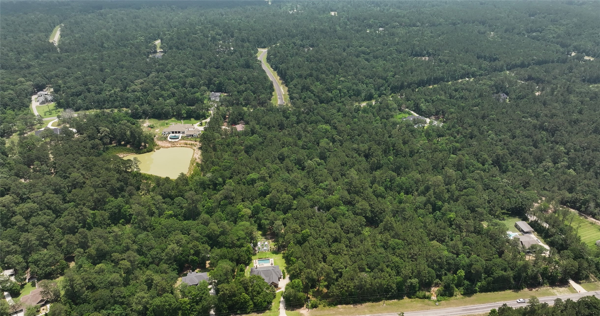 167 B Winchester Road Huntsville, TX 77340 - Photo 16 of 25 a view of a house with a street and trees