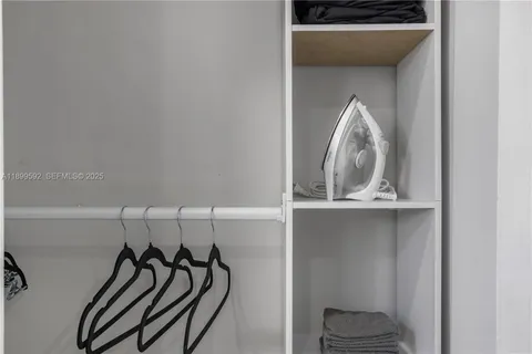 a view of a livingroom with rack and shoes