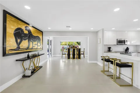 a view of a living room and dining room with furniture