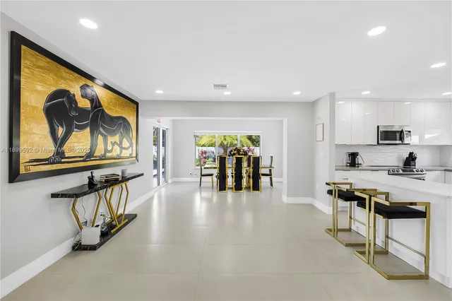 a view of a living room and dining room with furniture