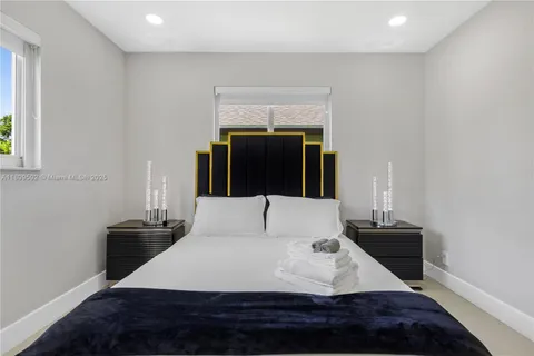 a living room with a couch and a large window