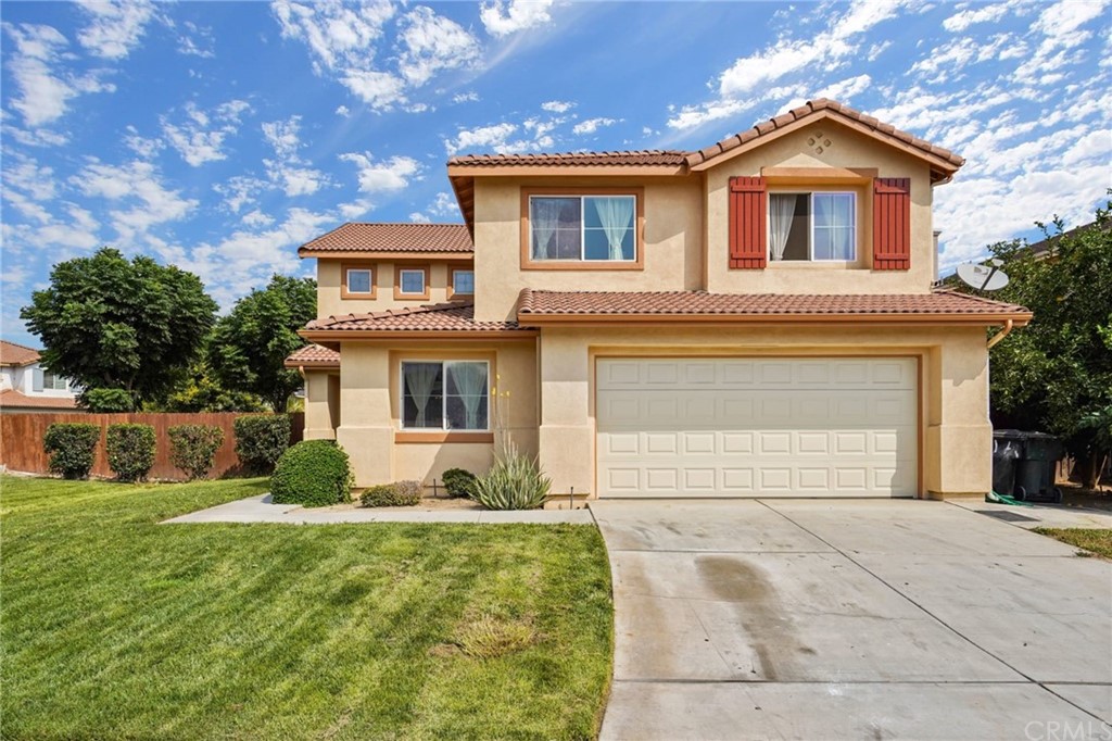 5237 Triesian Way. Riverside, CA 92509 - Photo 1 of 1 a front view of a house with garden