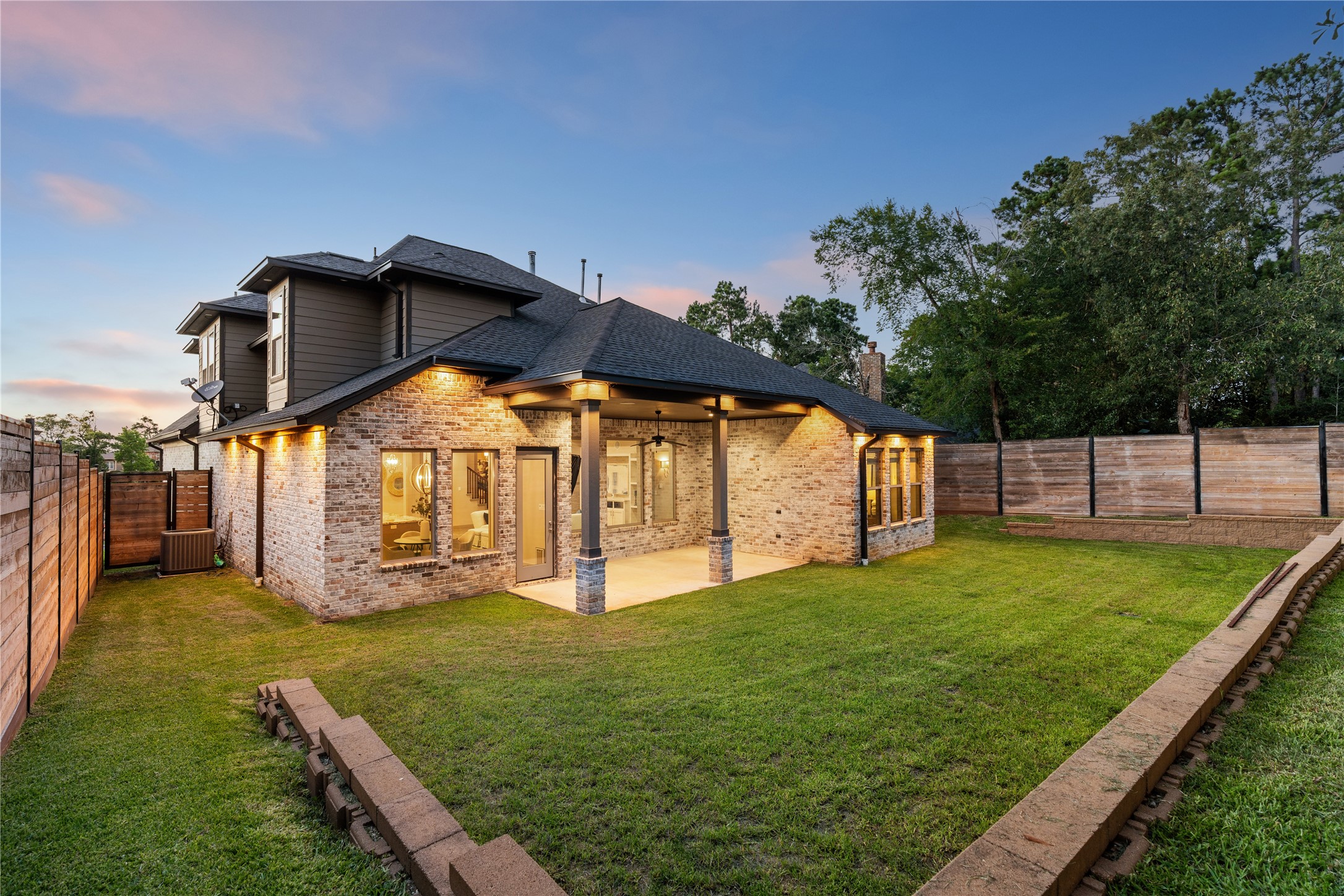 12379 Pebble View Drive Conroe, TX 77304 - Photo 39 of 46 Covered patio and elevated homesite across from the lake.