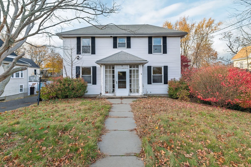 a front view of a house with garden