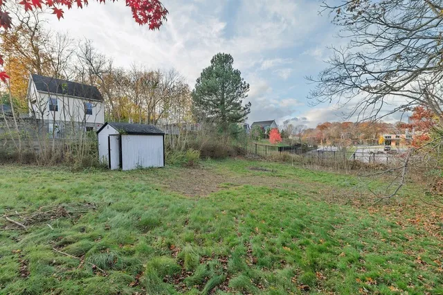 a backyard of a house with lots of green space