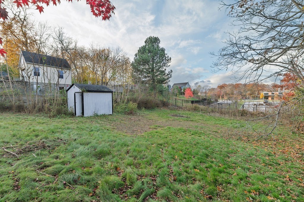 56 Putnam Street Weymouth, MA 02189 - Photo 23 of 39 a backyard of a house with lots of green space