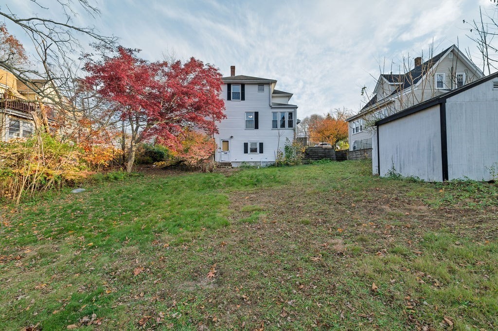 56 Putnam Street Weymouth, MA 02189 - Photo 25 of 39 a view of a house with a big yard and large trees