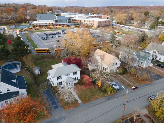 an aerial view of residential houses with outdoor space