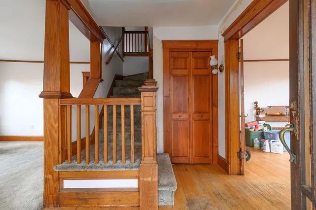 a view of front door with wooden floor