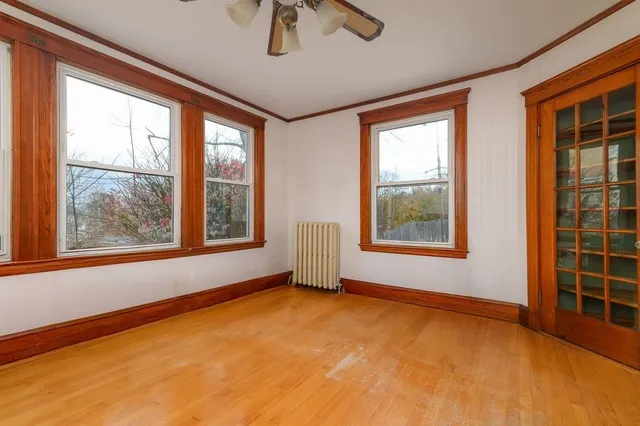 a view of an empty room with windows