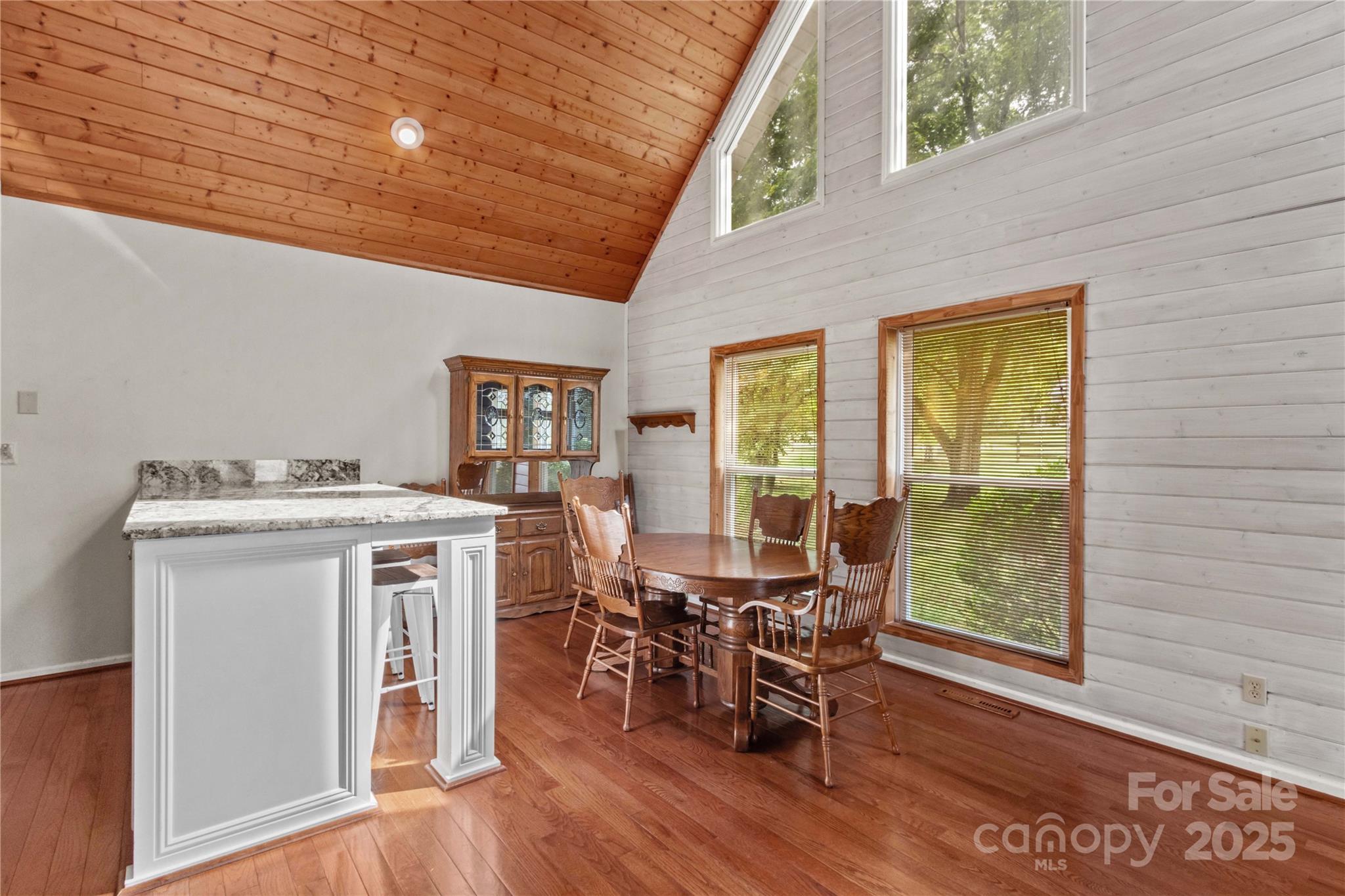 296 Hicks Creek Road Troutman, NC 28166 - Photo 11 of 48 a view of a dining room with furniture and wooden floor