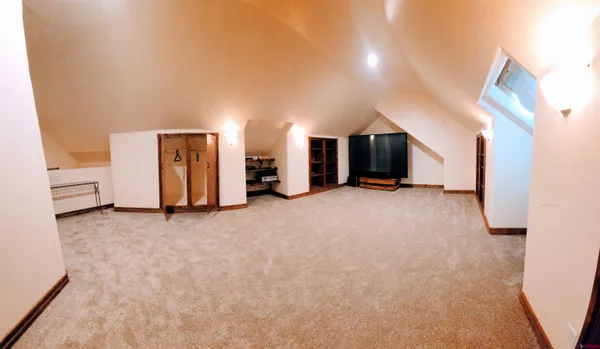 a view of a big room with closet and a bathroom