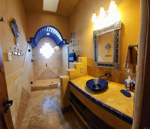 a living room with furniture a window and a chandelier