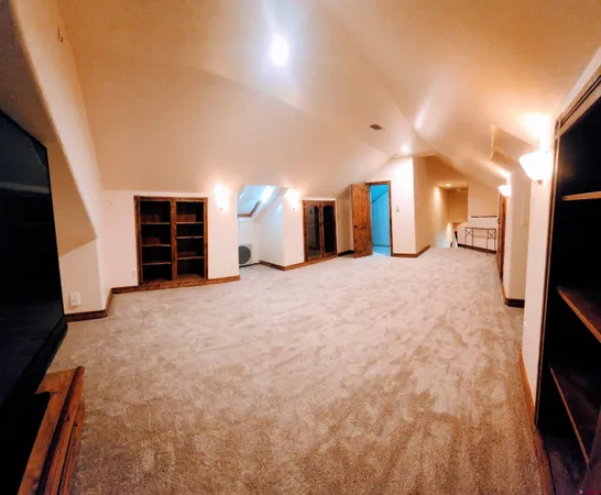 a view of a livingroom with a staircase