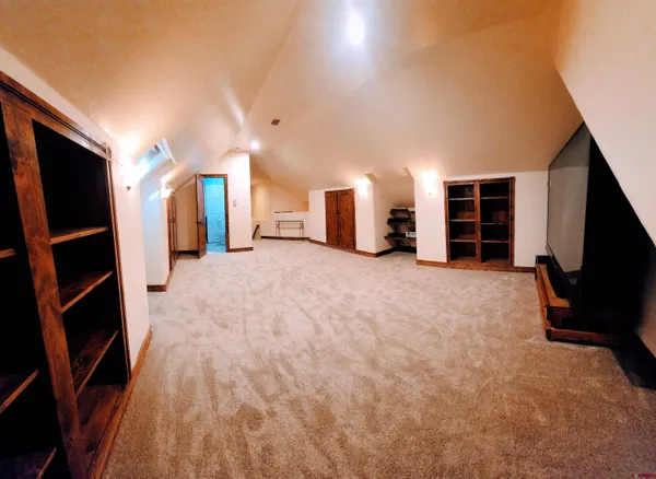 a view of empty room with a fireplace and cabinet