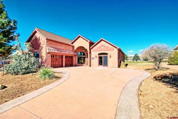 a view of a house with brick walls
