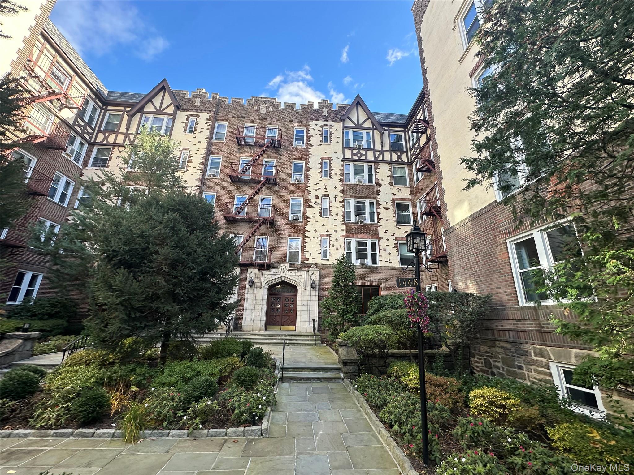 1468 Midland Avenue, Unit 2F Bronxville, NY 10708 - Photo 17 of 17 a view of a city with tall buildings
