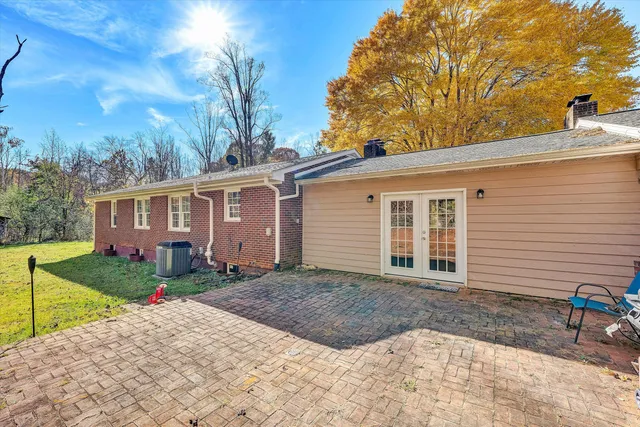 a view of a house with a yard and garage