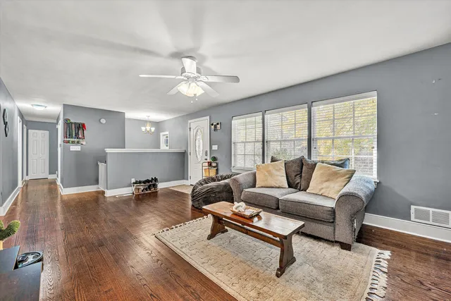 a view of a dining room with furniture and wooden floor