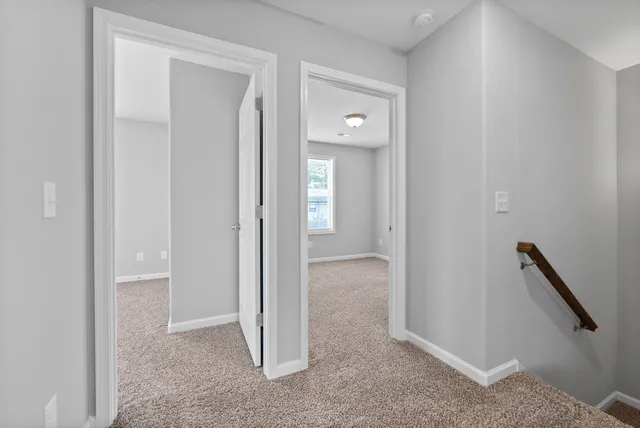 a view of a bathroom with a glass door and closet