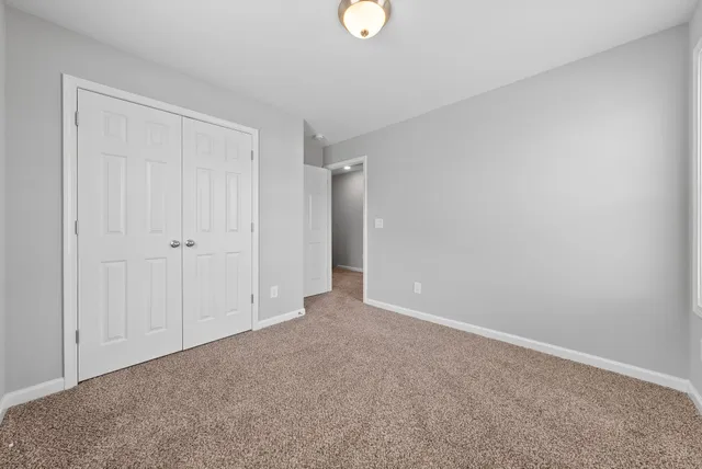 a view of a pathway both side of house