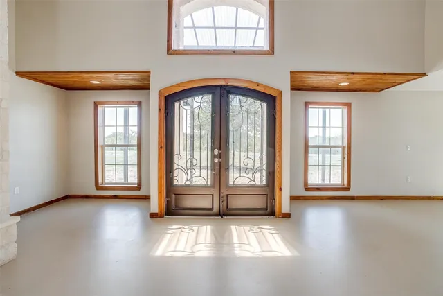 a view of an entryway with wooden floor