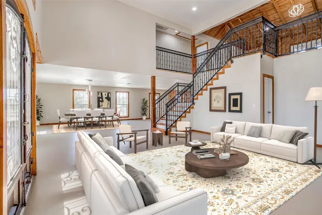 a view of a livingroom with furniture and a flat screen tv