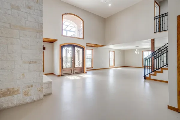 a view of a livingroom with furniture and a flat screen tv