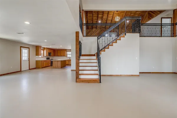 a view of a livingroom with furniture and a flat screen tv