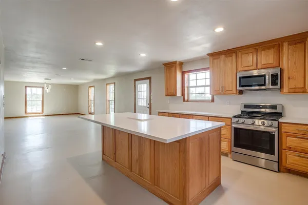 a bathroom with a toilet a sink and a mirror