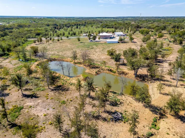 a view of a lake with a yard