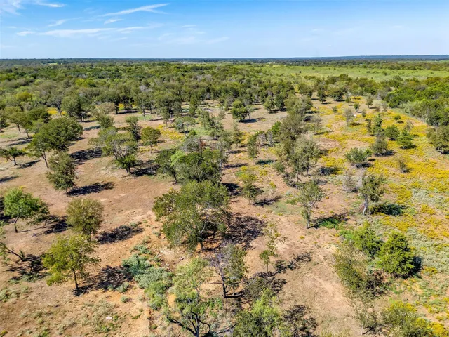 a view of swimming pool with a yard and sitting area