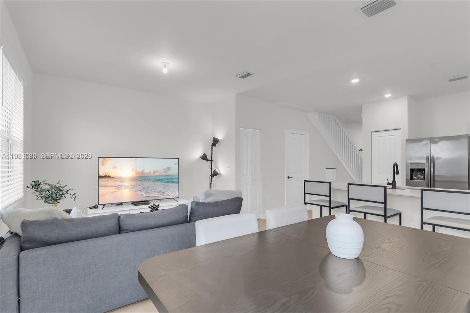 16264 Southwest 292nd Street Homestead, FL 33033 - Photo 11 of 29 a living room with furniture and a table