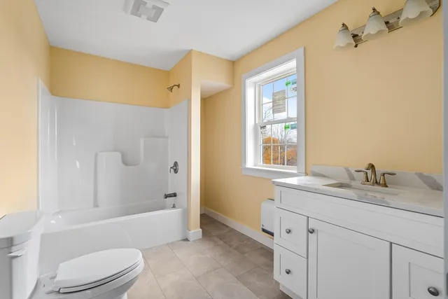 a view of an empty room with stairs