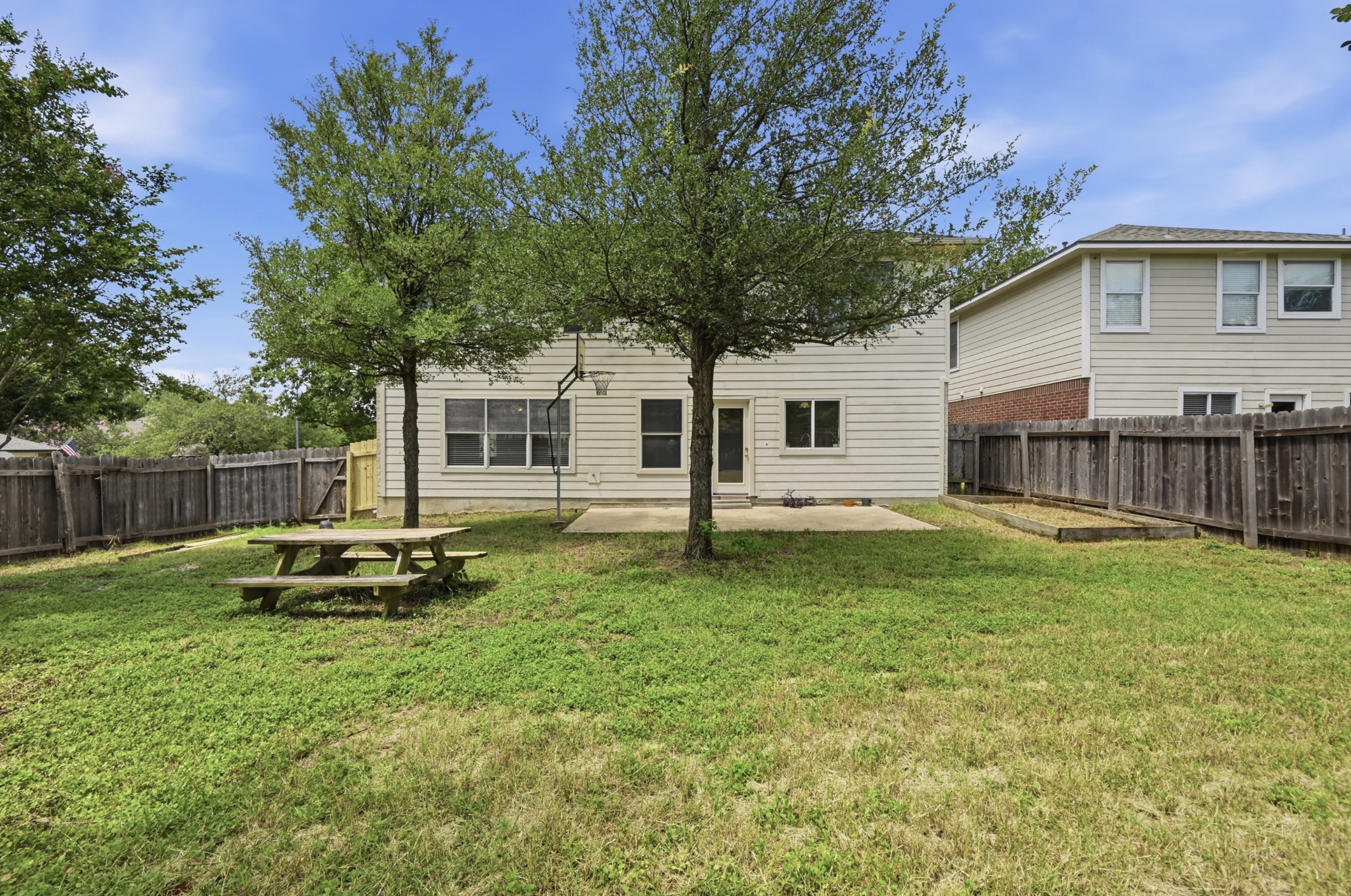 2700 Cradlerock Terrace Austin, TX 78748 - Photo 28 of 29 a backyard of a house with table and chairs