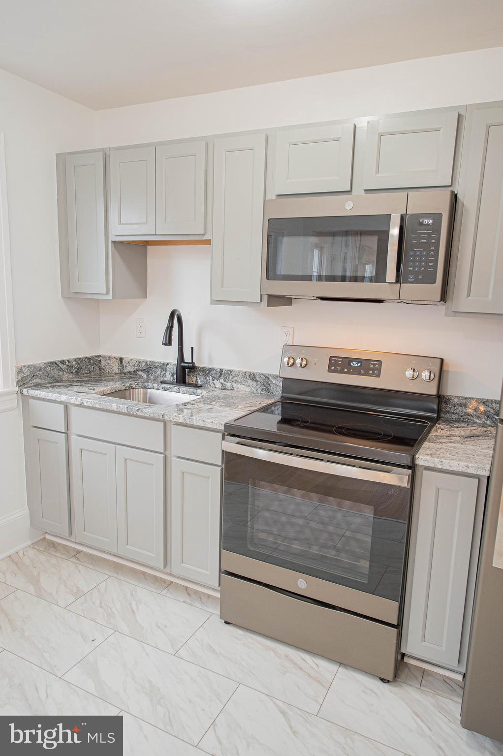 308 North Division Street, Unit 16 Salisbury, MD 21801 - Photo 23 of 61 a kitchen with appliances cabinets and a sink