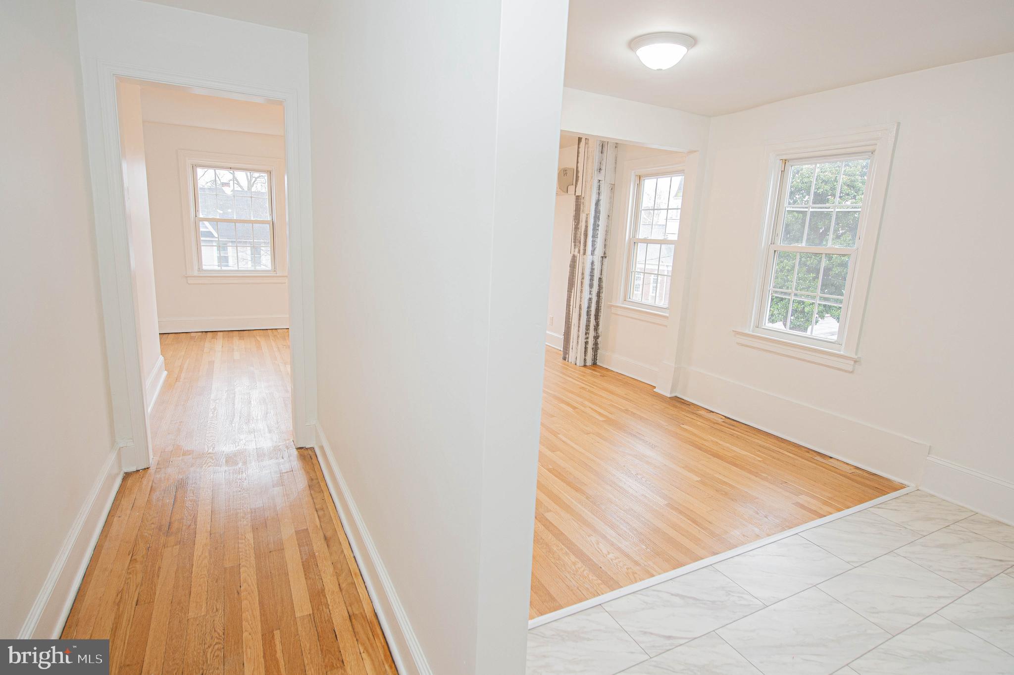 308 North Division Street, Unit 16 Salisbury, MD 21801 - Photo 26 of 61 wooden floor in an empty room with a window
