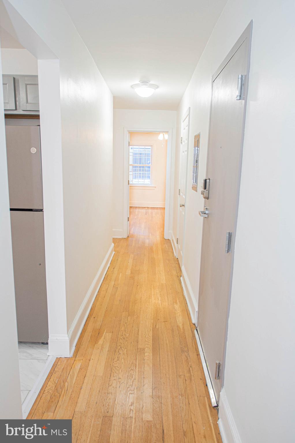 308 North Division Street, Unit 16 Salisbury, MD 21801 - Photo 28 of 61 a view of a hallway with wooden floor